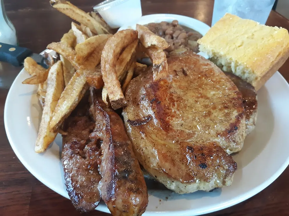 Pork Chops Home Cut French Fries BBQ Baked Beans Cornbread and Side of Sausage Link